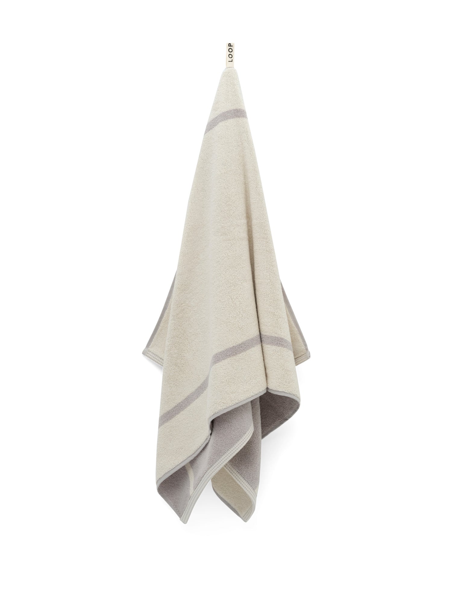 LOOP HOME butter and stone bath towel draped showing full pattern