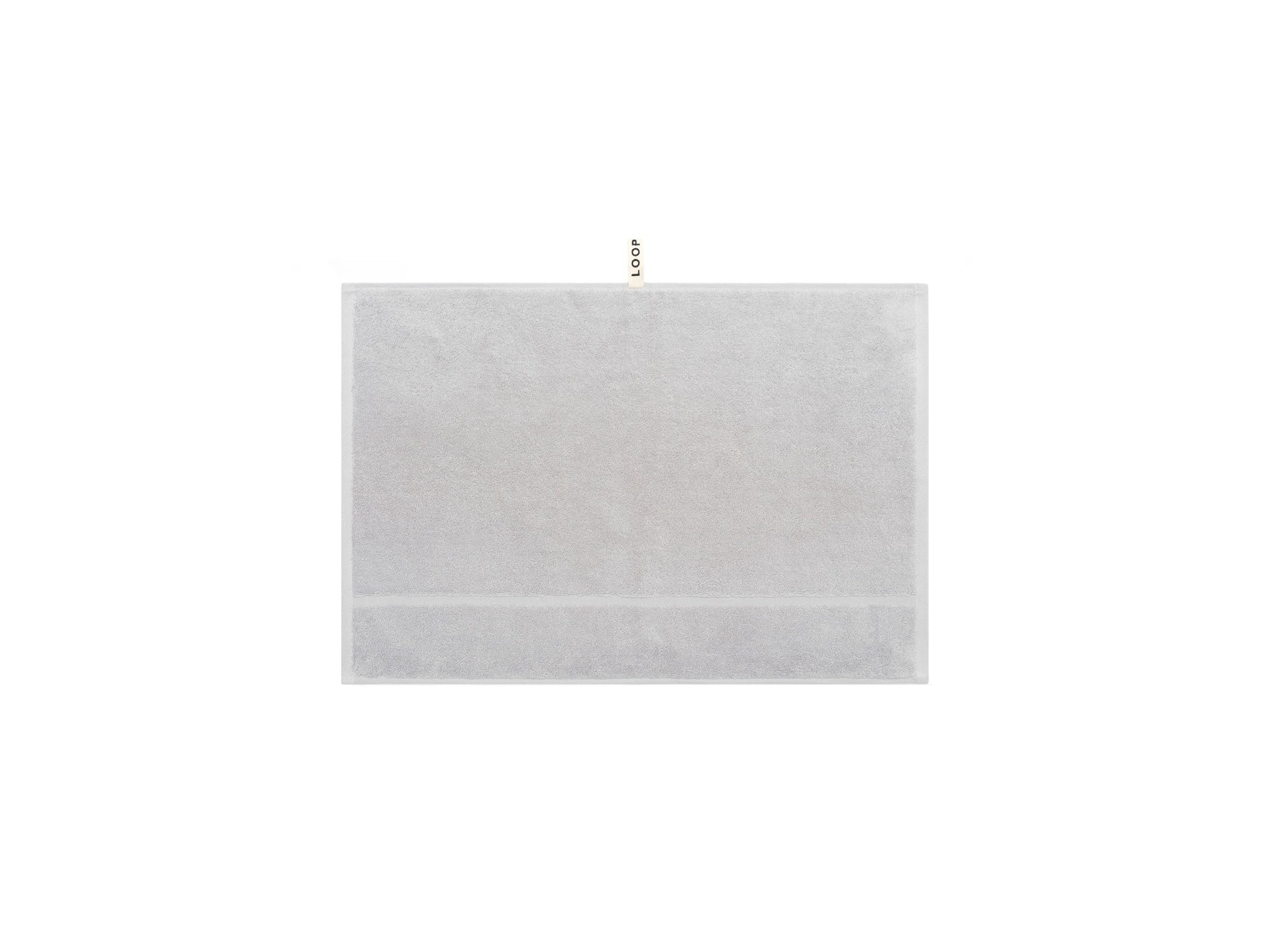 LOOP HOME stone hand towel folded showing bold stripe pattern