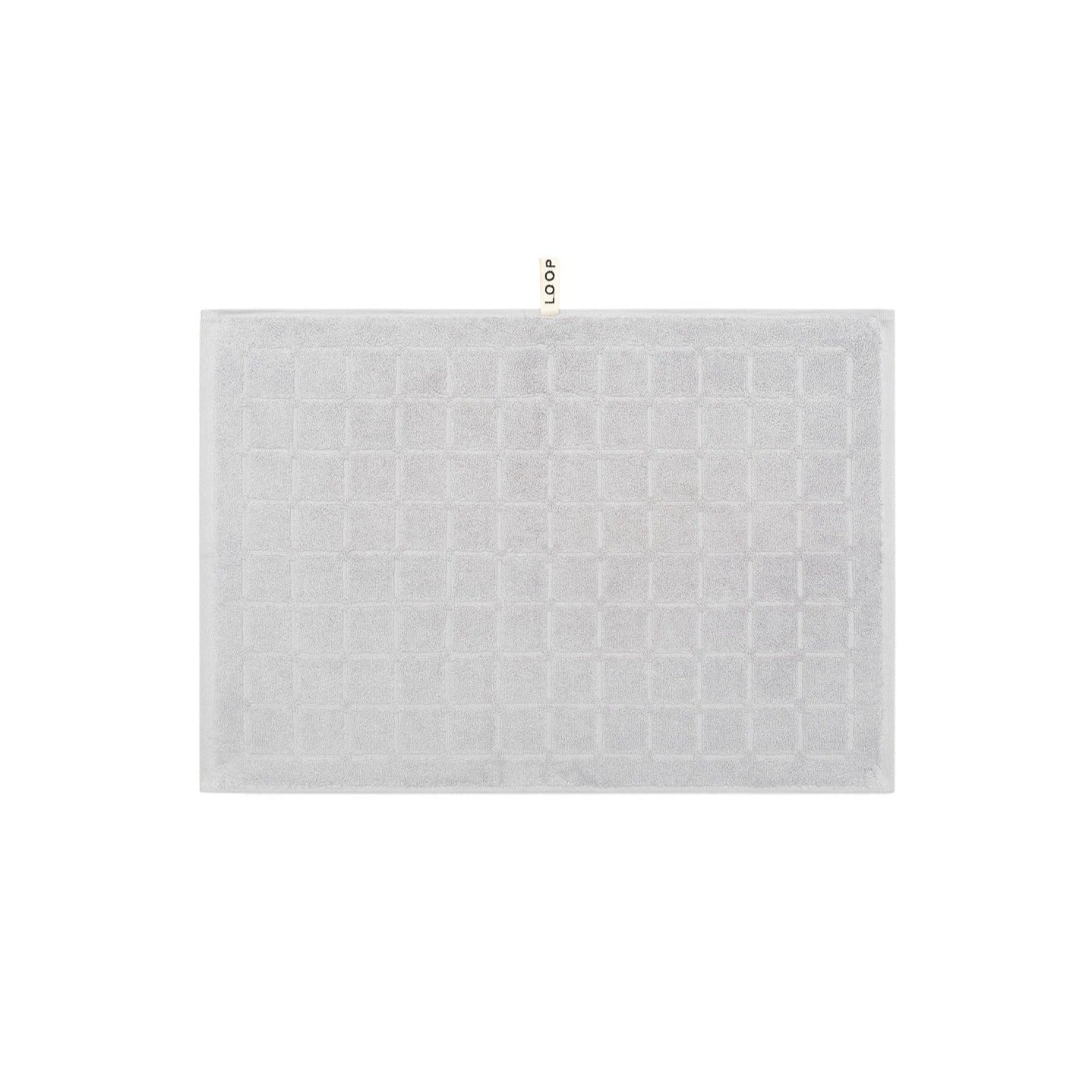 LOOP HOME stone hand towel neatly folded on plain background
