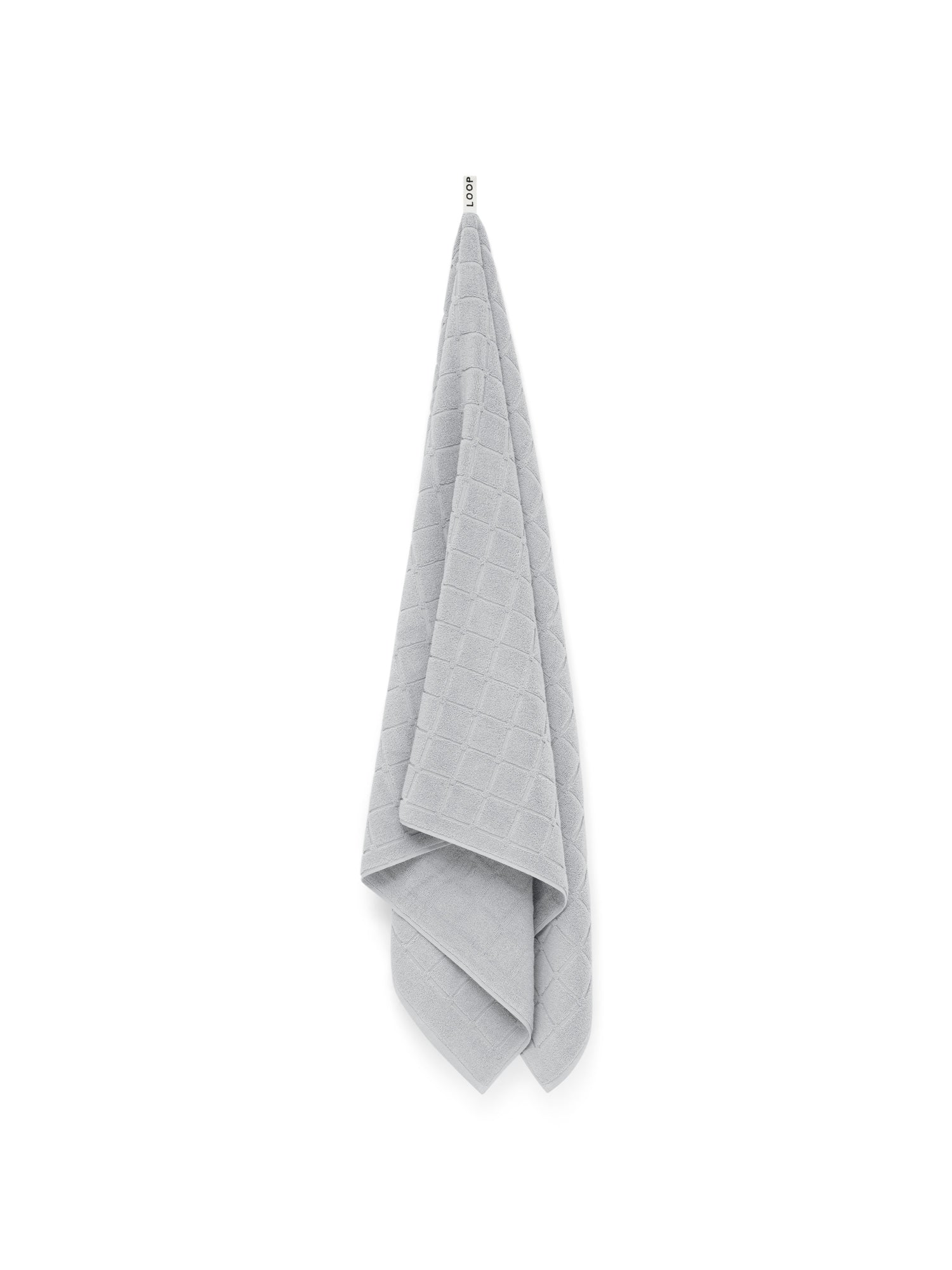 LOOP HOME stone bath sheet showing woven texture and fringe detail