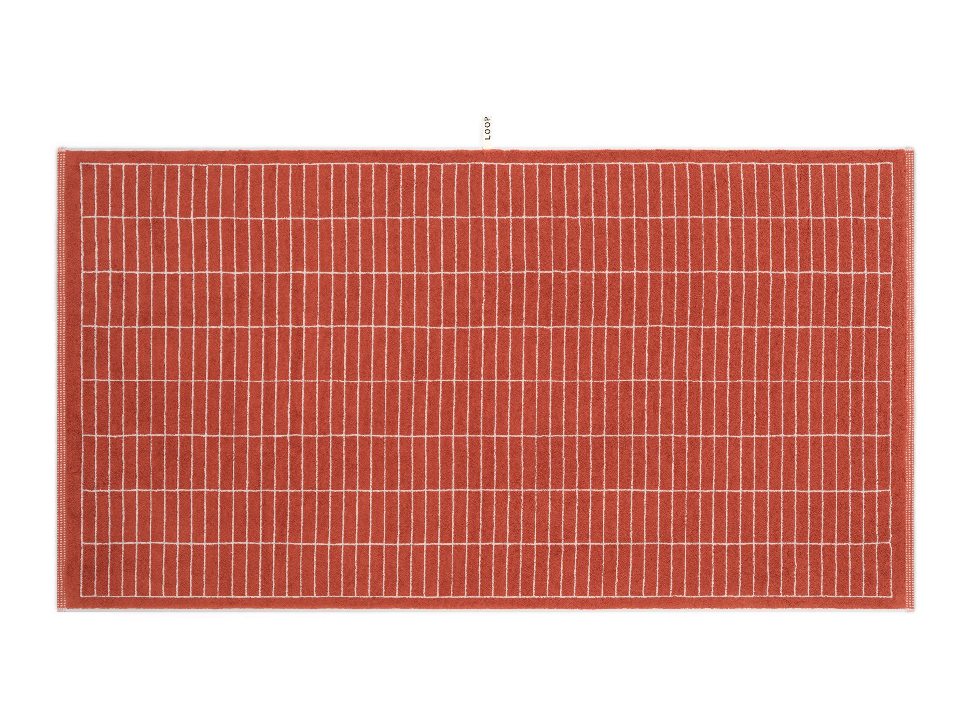 LOOP HOME terracotta and stone bath sheet folded showing woven texture