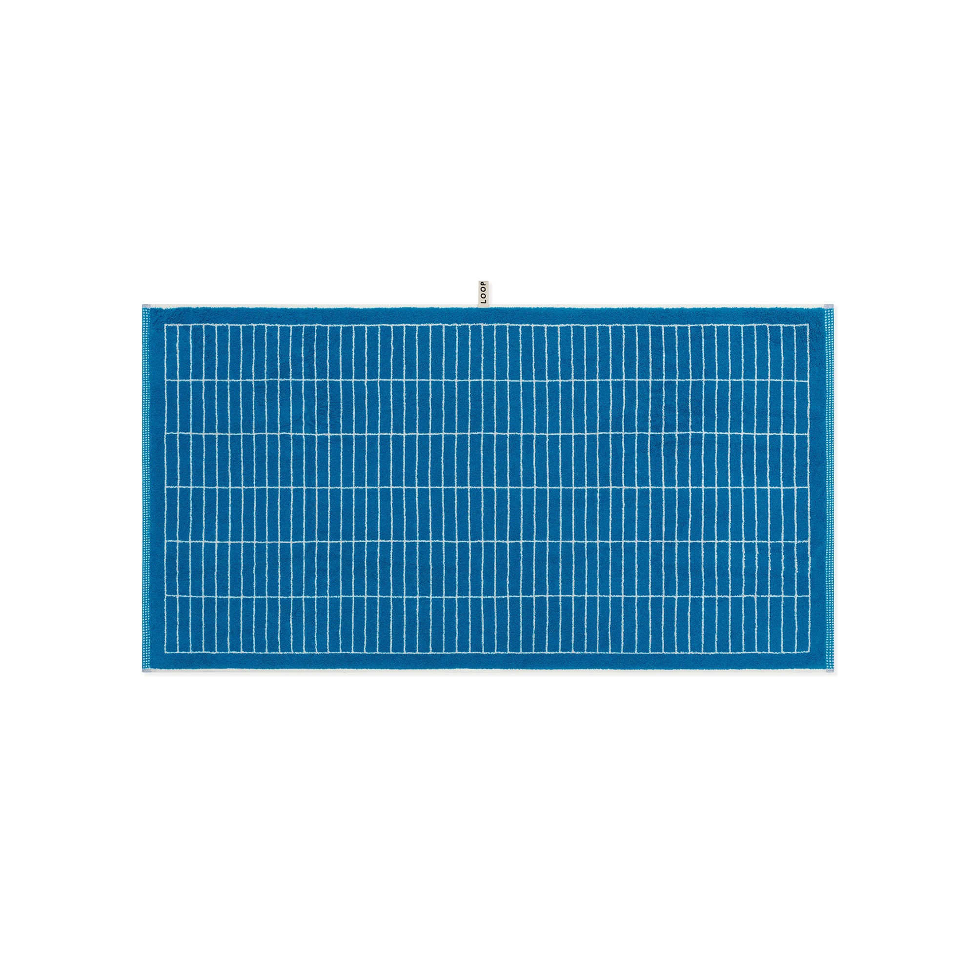 LOOP HOME cobalt and ivory bath towel showing weave detail