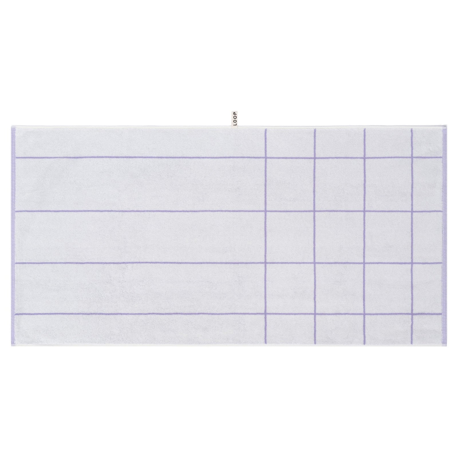 LOOP HOME lilac bath towel neatly folded on styled surface