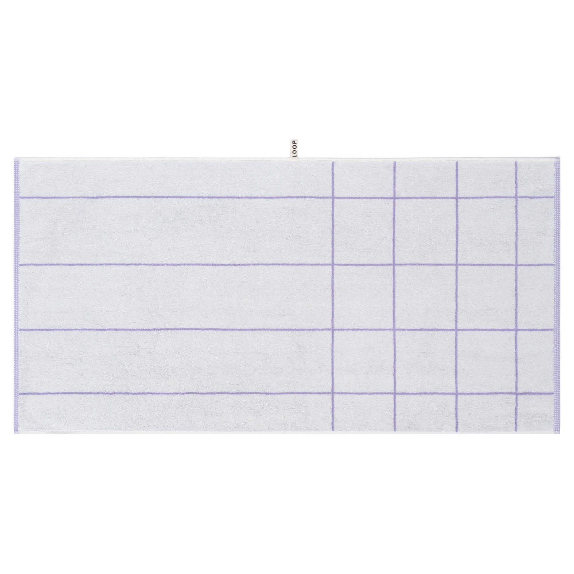 LOOP HOME lilac bath towel neatly folded on styled surface
