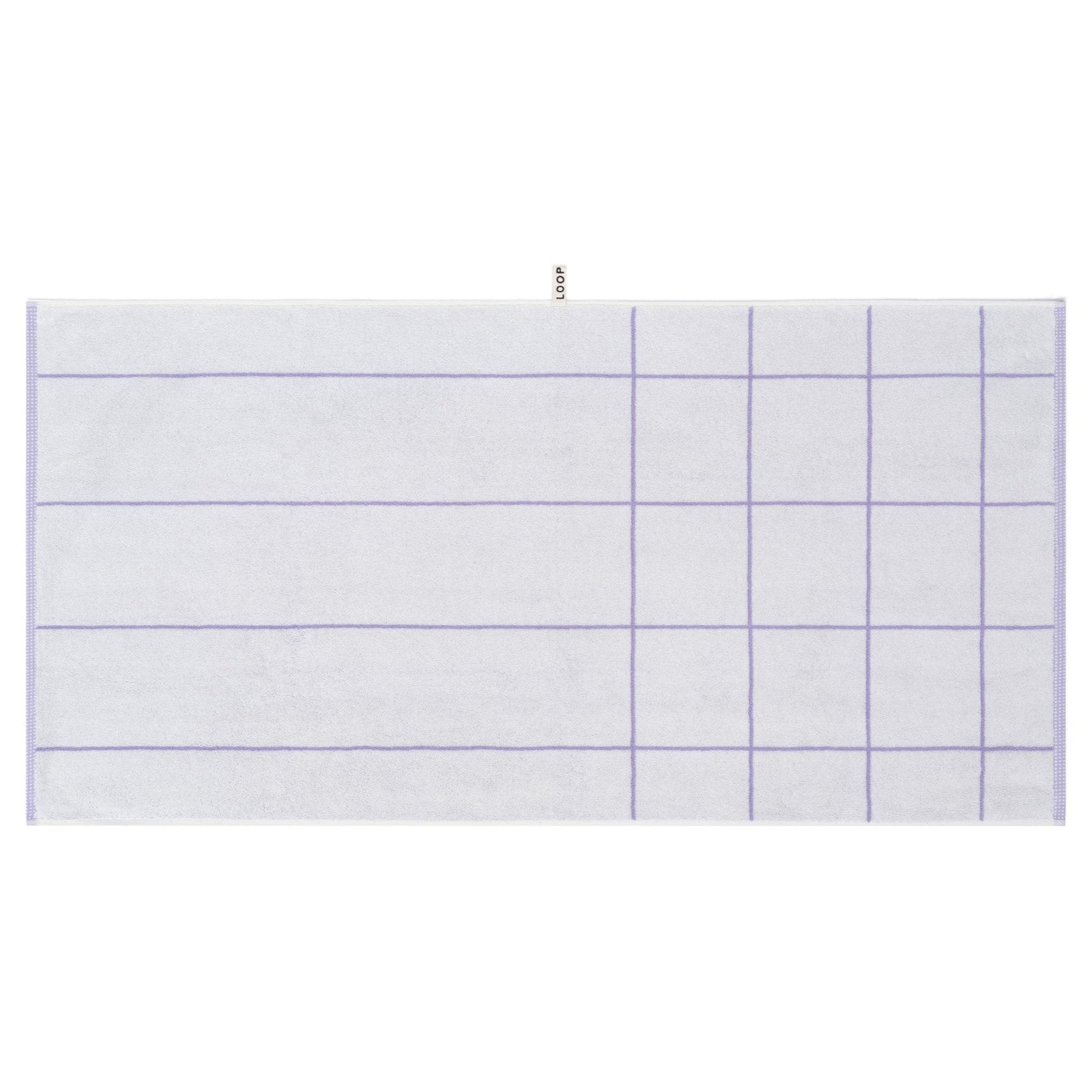 LOOP HOME lilac bath towel neatly folded on styled surface