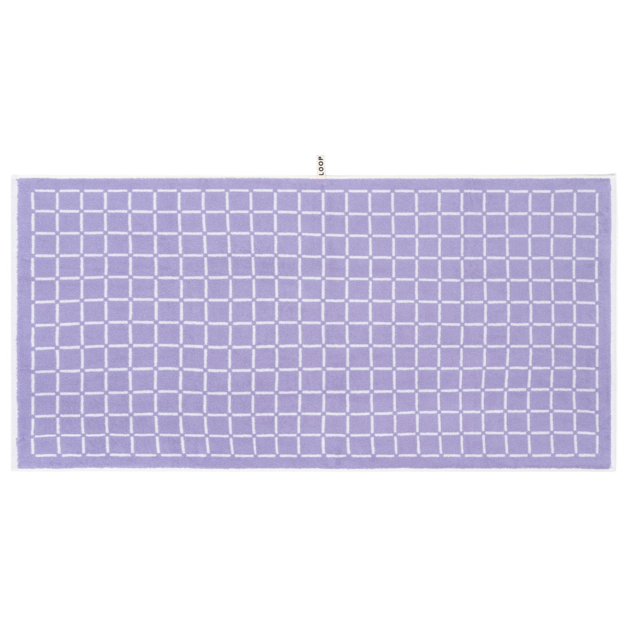 LOOP HOME lilac bath towel folded showing striped design